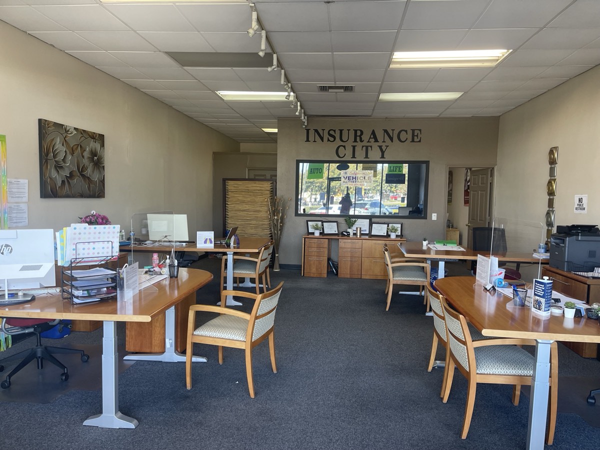 Independent insurance brokerage office where bilingual agents shop multiple carriers for customers in California